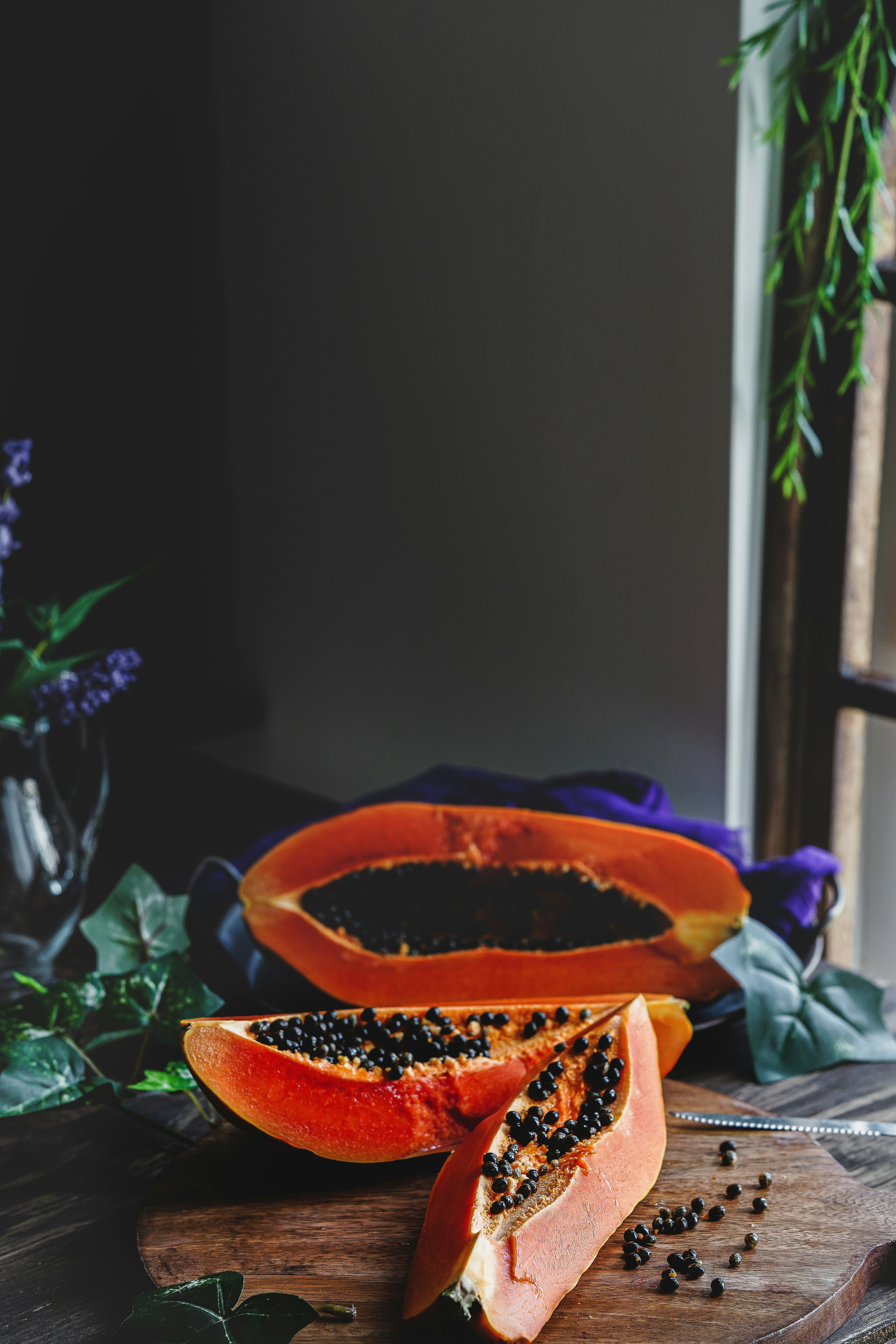 orange flower in brown pot